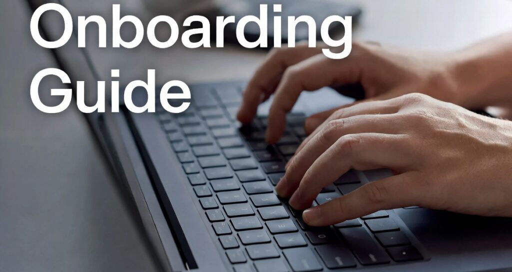 Hands typing on a laptop keyboard with the text “Onboarding Guide”